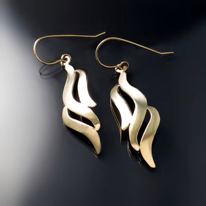 elegant gold earrings wave design