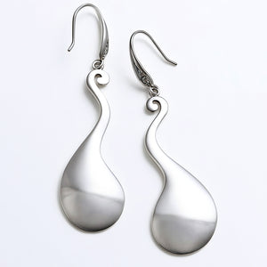 elegant long silver statement earrings swirl drop
