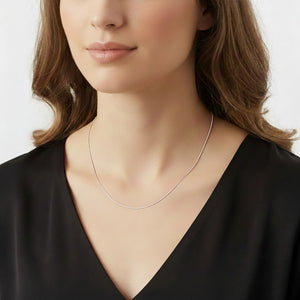 fine 14K white gold box link chain on model