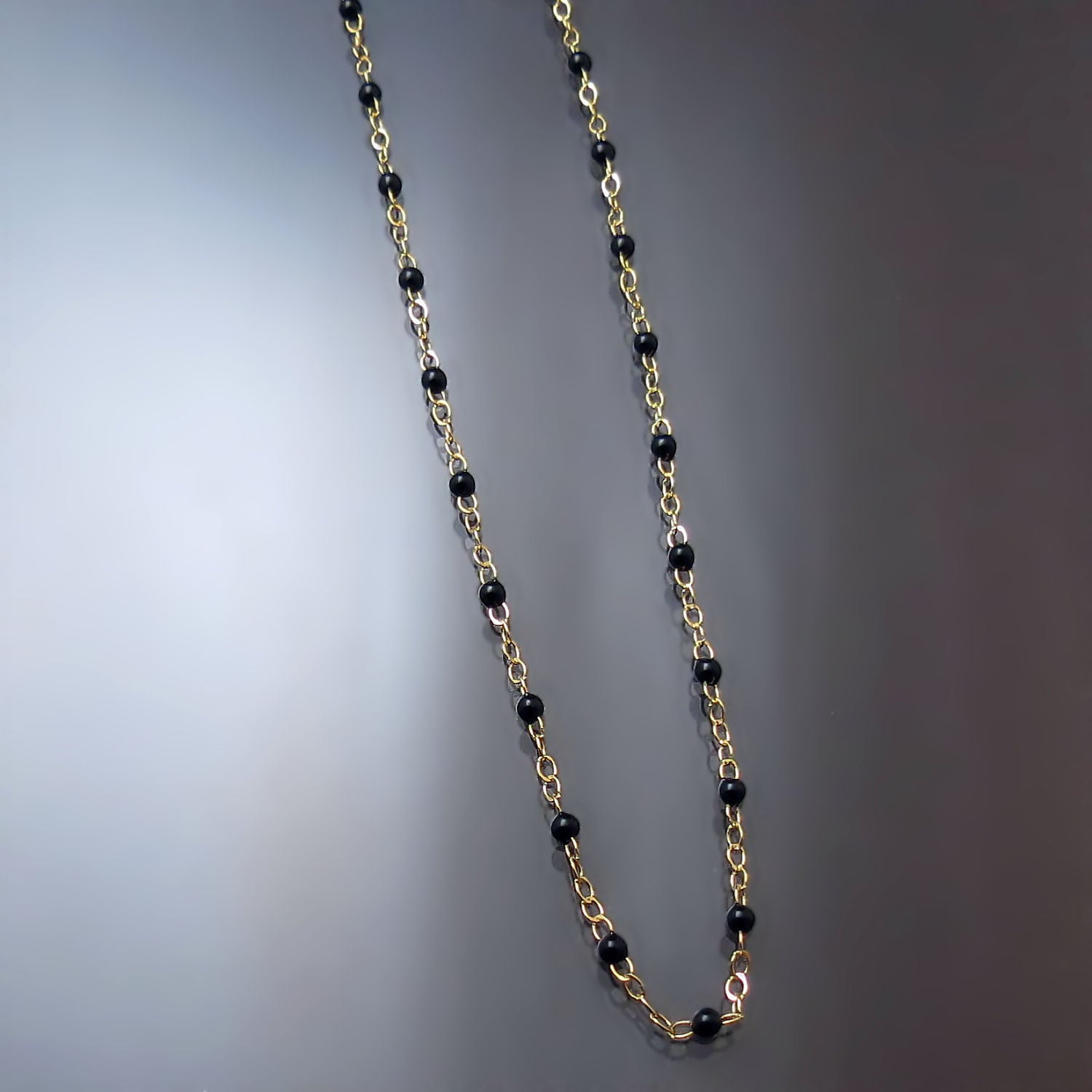 gold black bead chain necklace