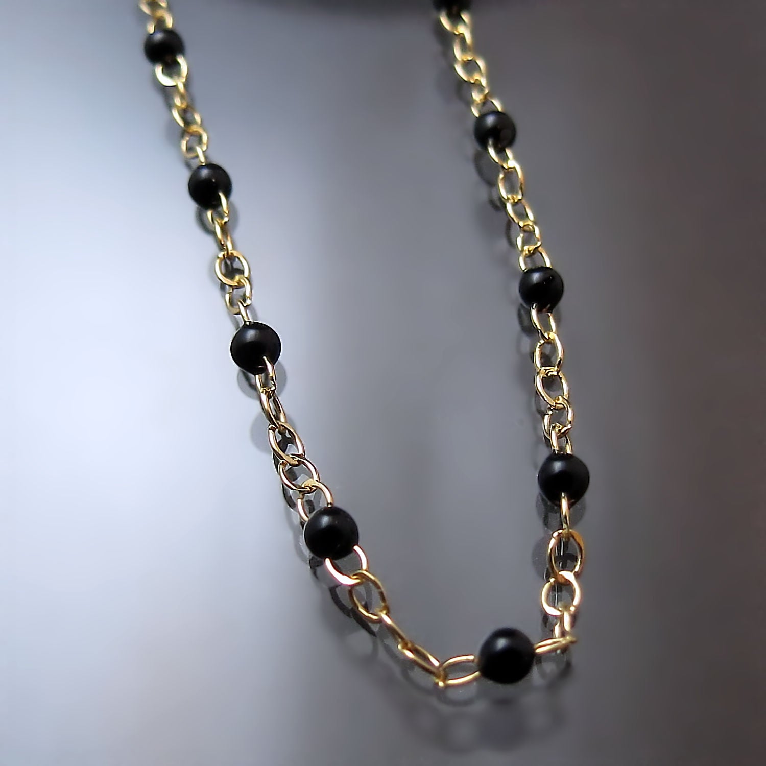 gold black bead chain necklace