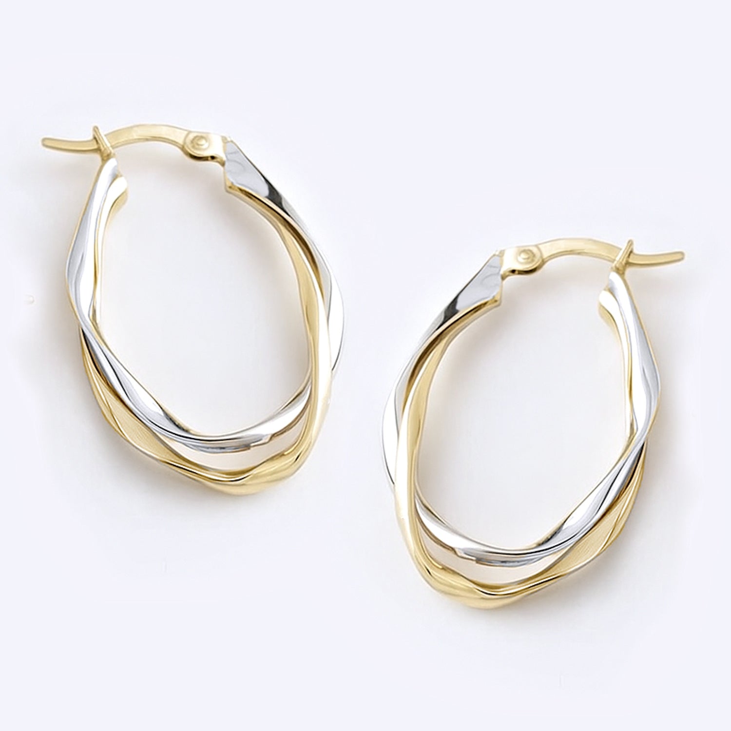 oval hoops earrings two tone gold twisted intertwined
