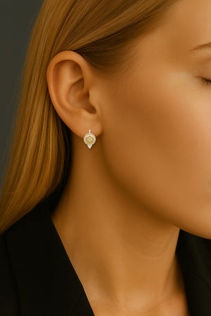 petite byzantine medallion earrings on model in yellow gold