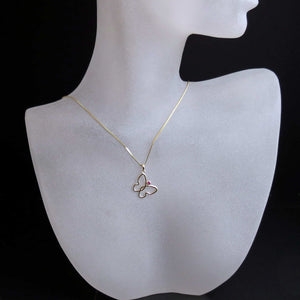 Pink sapphire butterfly necklace in yellow gold