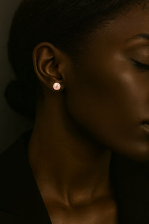 shimmery dome 14K rose gold studs earrings on model