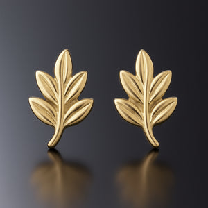 pair of tiny leaf stud earrings in gold