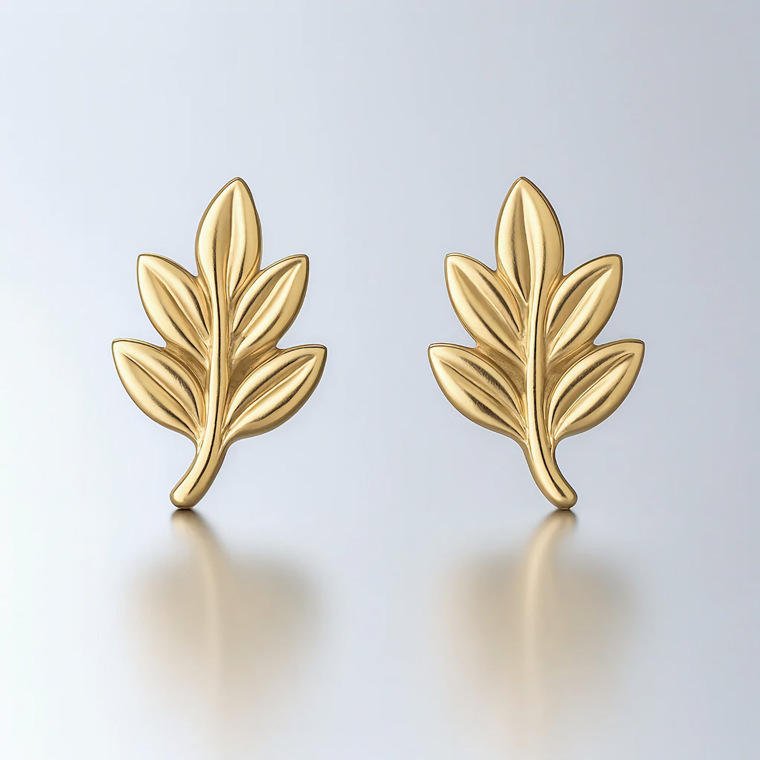 tiny leaf studs earrings yellow gold