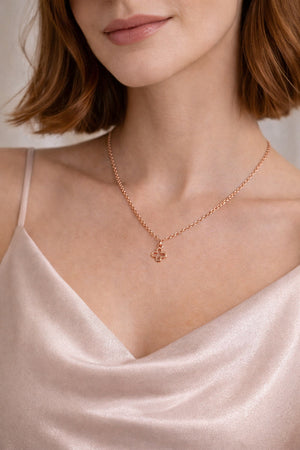 tiny rose gold clover charm pendant necklace on model