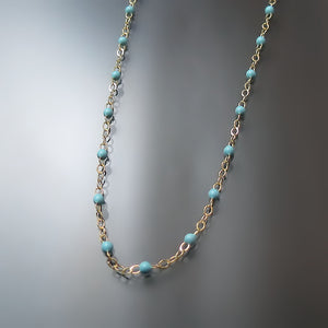 turquoise bead station necklace in yellow gold