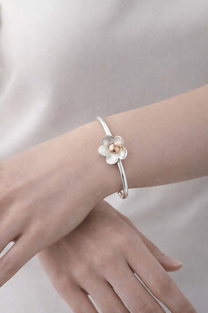 two tone daisy cuff bracelet on model