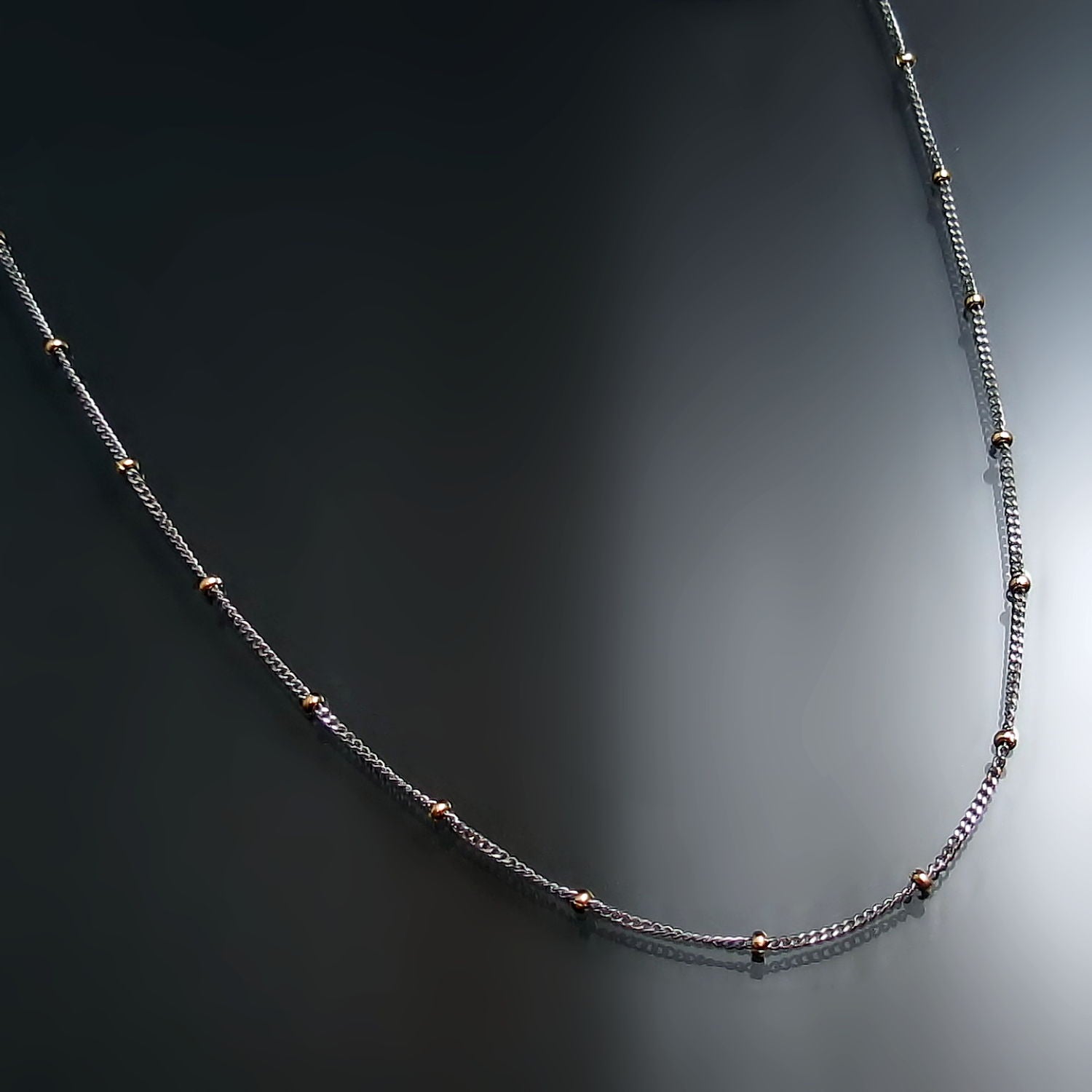 Two tone gold bead station chain necklace