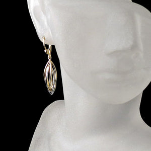 two tone gold dangle earrings spiral twist cage