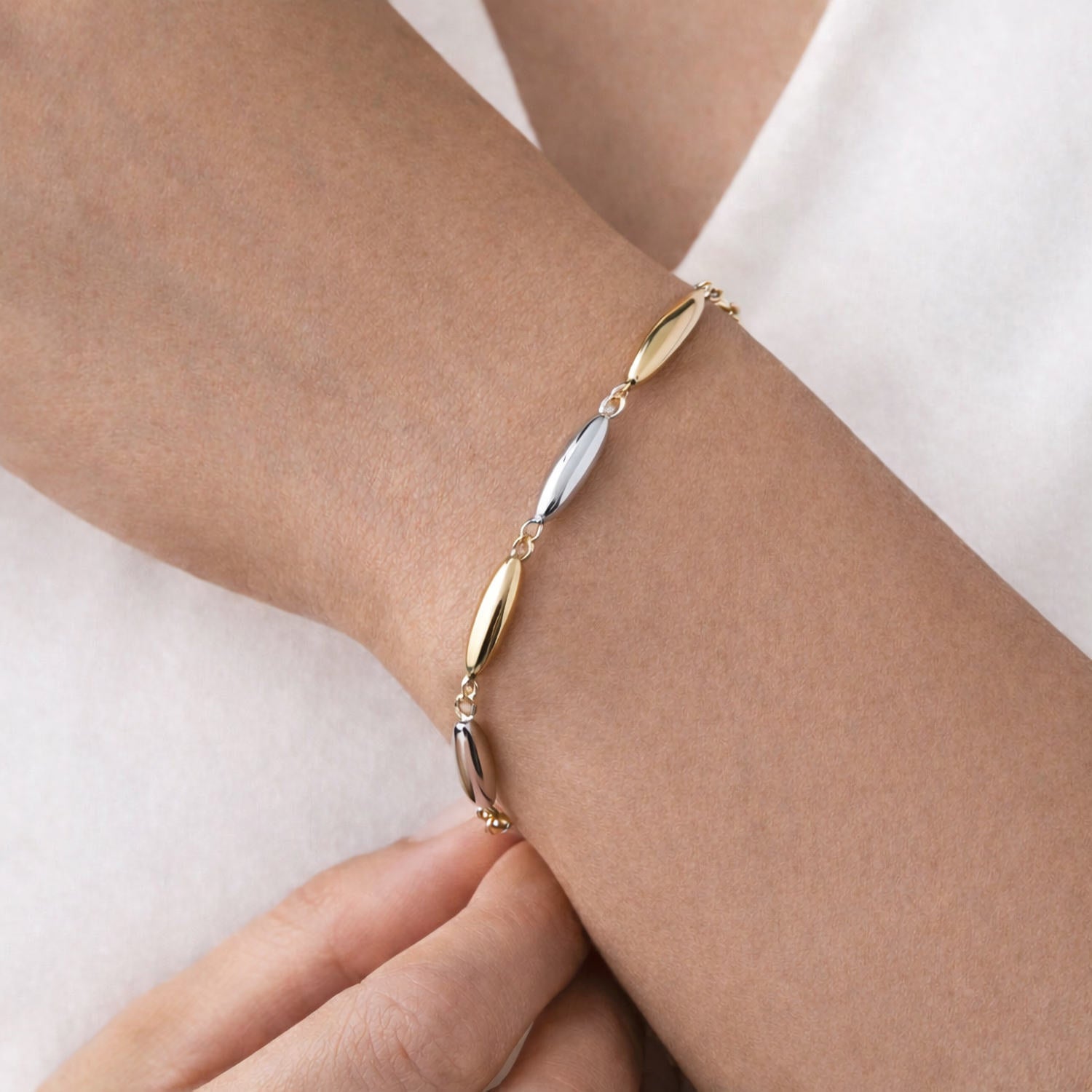 modern minimalist oblong link two tone gold bracelet