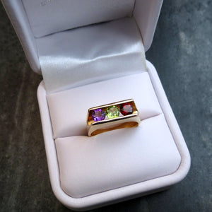 modern ring with amethyst peridot garnet gemstones